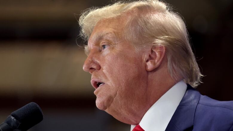 Former U.S. president Donald Trump is seen speaking at a rally in Iowa.