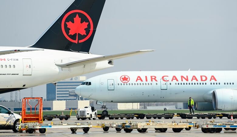 Planes on the tarmac at an airport.