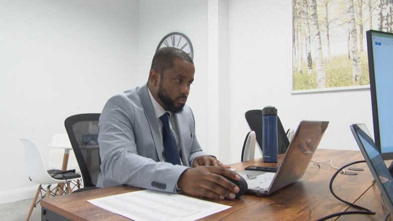 Mortgage broker Patrick Betu in his office.