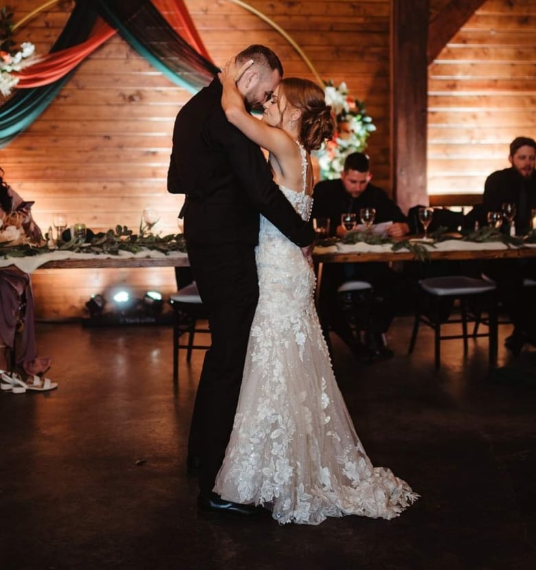 A husband and wife dance on their wedding day.