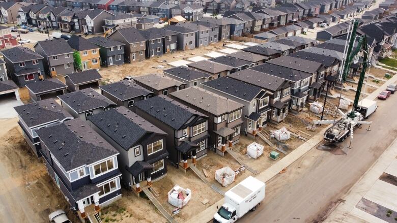 Rows of two-storey homes under construction.