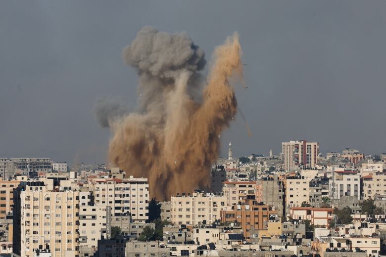 Smoke rises following Israeli strikes in Gaza on Oct. 7, 2023.