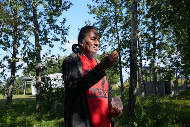 Elder Alex Moonias offers Tobacco to the land at Landsdowne House.