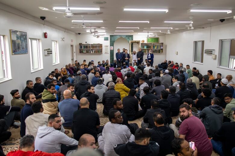 Men gather for prayer at a mosque.