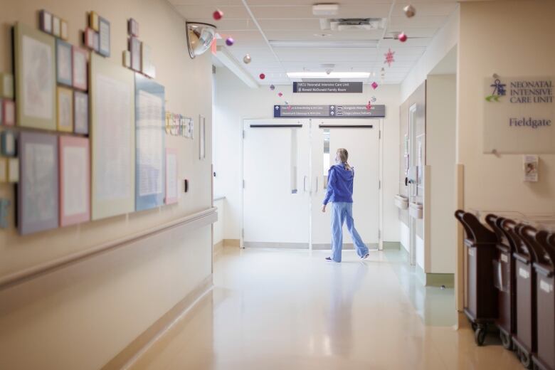 A healthcare worker enters the paediatrics department at Markham Stouffville Hospital, in Markham, Ont., on Dec. 1, 2022.