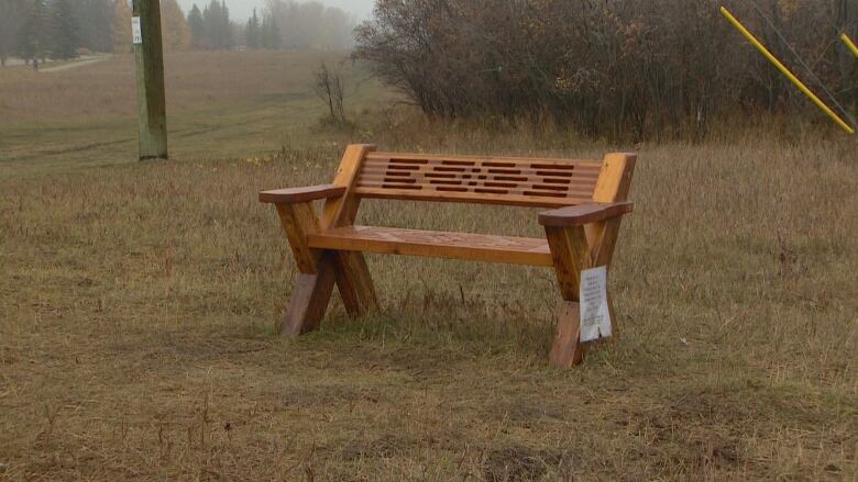 A park bench is pictured. 