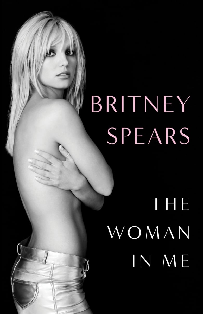 A photo cover of a woman wearing jeans and covering her naked torso with her hands.