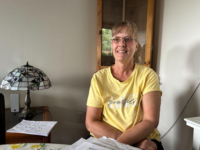 woman in yellow shirt in her apartment