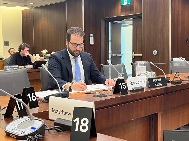 Steve de Eyre, Director of Public Policy and Government Affairs at TikTok Canada, sits in a committee room before testifying before a House of Commons committee on Wednesday, Oct. 18, 2023.