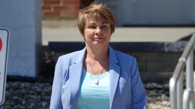 a woman in a blue suit