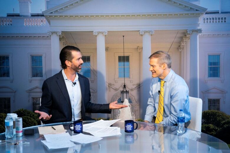 Jordan seated next to Donald Trump Jr.