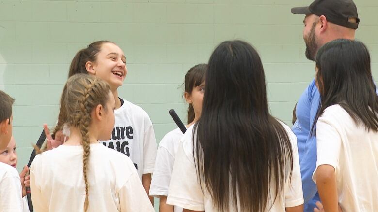 Young athletes listen to instruction Sunday during an event at the University of Prince Edward Island.