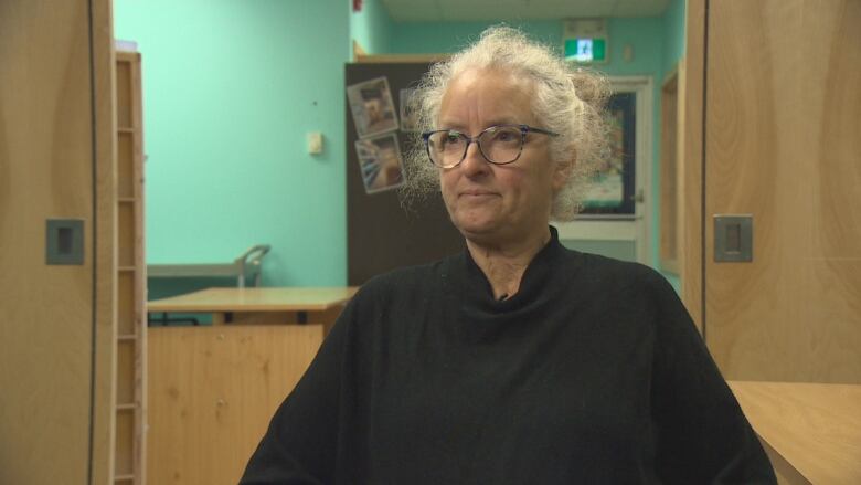 Bev sits for an interview in the Canadian Mental Health Association office. 