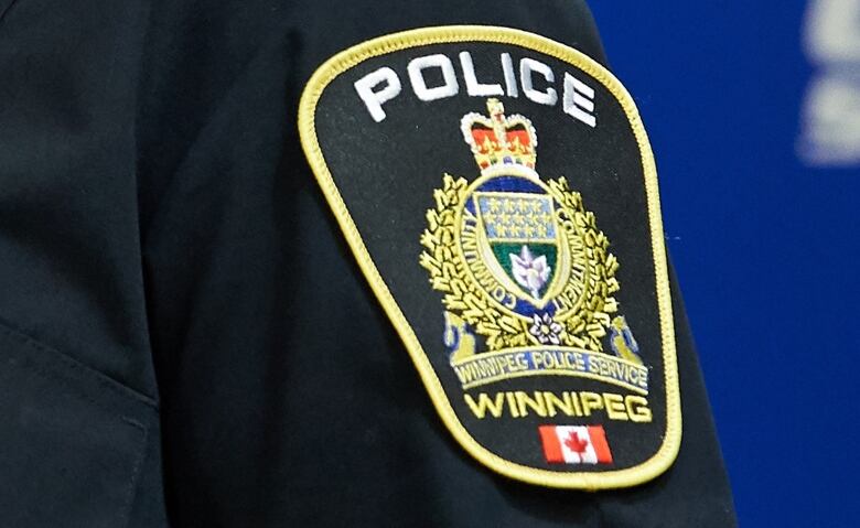 A Winnipeg police badge is shown.