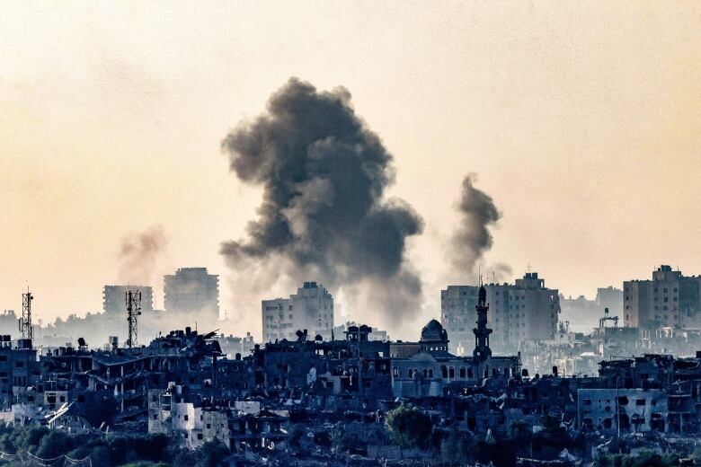 A view of the aftermath of an Israeli airstrike in a northern part of the Gaza Strip, as seen from the Israeli city of Sderot.