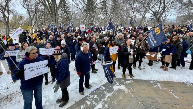 Nurses, nursing students and members of the public rallying in Wascana Park.