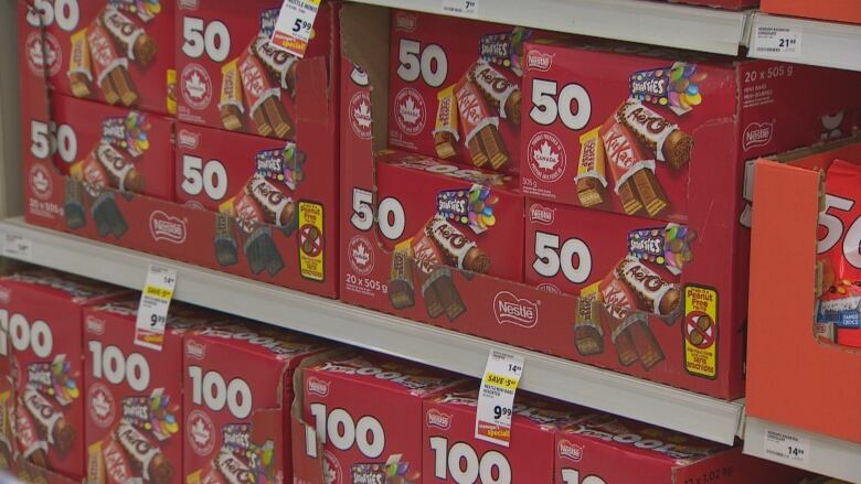 A red box of Nestl chocolates sits on the shelf. 