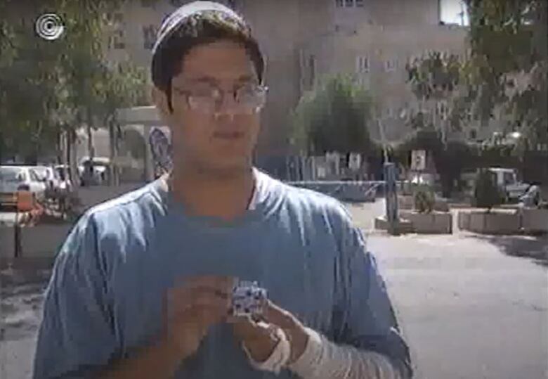 A youthful Ben Gvir shows off a Cadillac hood ornament he claimed to have taken from PM Yitzhak Rabin shortly before the Israeli peacemaker was assassinated. Convicted of terrorism charges, Ben Gvir is today Israel's minister of national security.