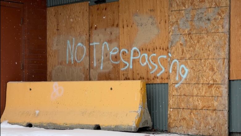 A sign reads no trespassing.