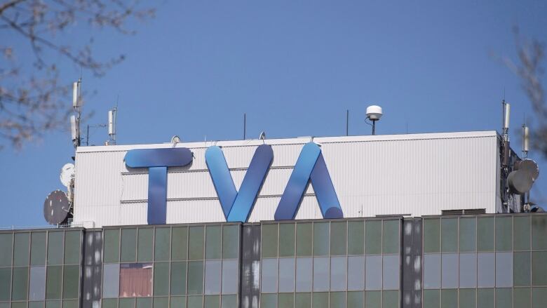 Building with T-V-A logo.