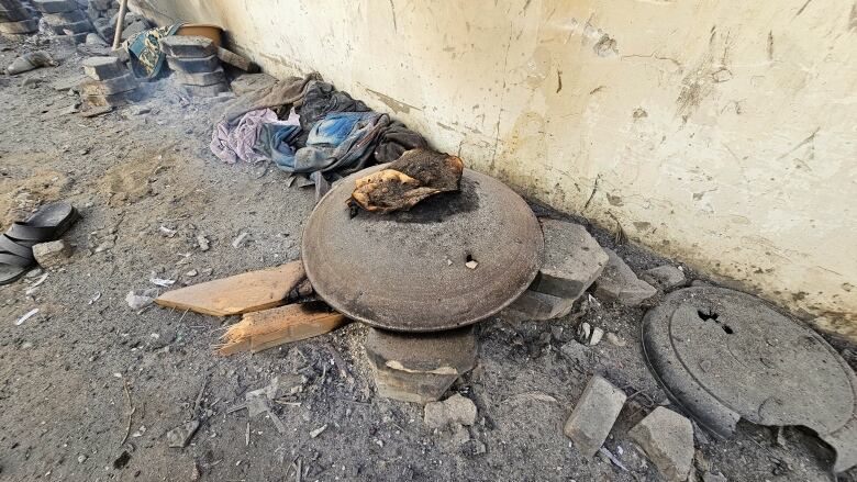 Burnt food and damaged belongings are seen at the site of a reported Israeli airstike in the Jabalia refugee camp in Gaza.