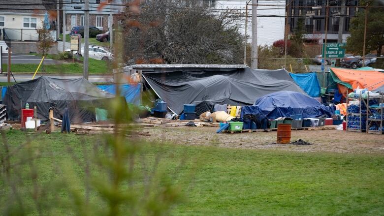 A field with tents is shown