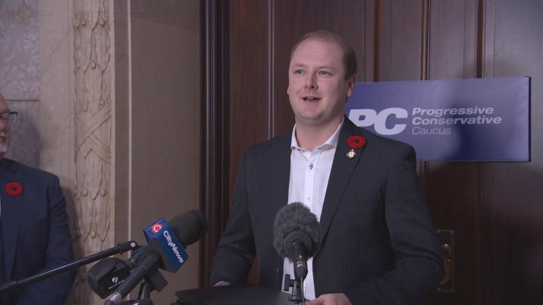 A man standing behind a podium.