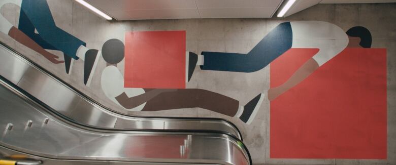 Image of a mural painted on a wall next to an escalator. It features large-scale human figures painted in a minimalist style, similar to wayfinding figures. They hold orange squares, or collide into them.