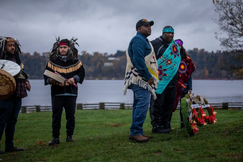 People in Indigenous attire at a ceremony