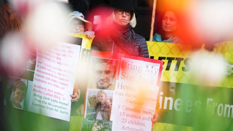 Sally Lane, mother of Jack Letts, stands on the steps of the Prime Ministers office with supporters in Ottawa on Thursday, May 19, 2022. The federal government has rebuffed an offer from a civil society delegation to travel to northeastern Syria on Ottawa's behalf to repatriate detained Canadians.