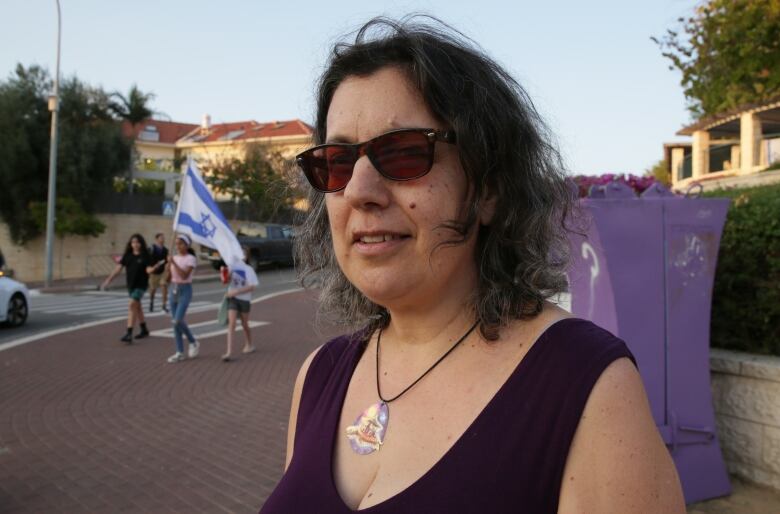 Noa Pora stands in front of Israelis marching to Jerusalem to call for more action on the safe return of Israeli hostages from Gaza.