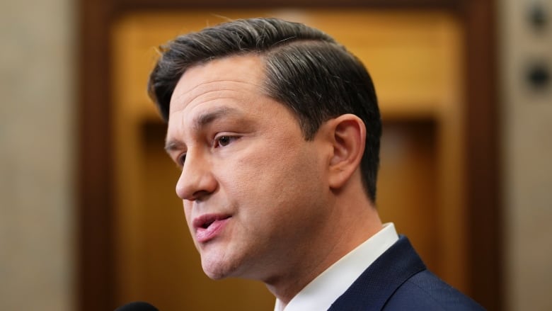 Conservative Leader Pierre Poilievre speaks to reporters in the foyer of the House of Commons on Parliament Hill in Ottawa on Monday, Nov. 6, 2023. 