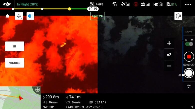 A drone image from a thermal camera shows a tiny yellow dot amid a sea of red.