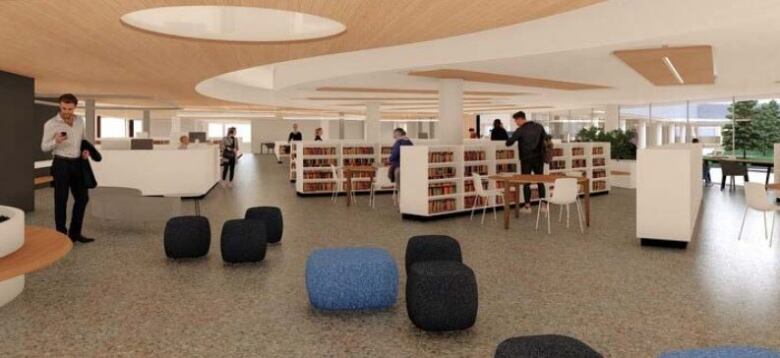 Indoor view of people sitting on chairs among shelves of books.