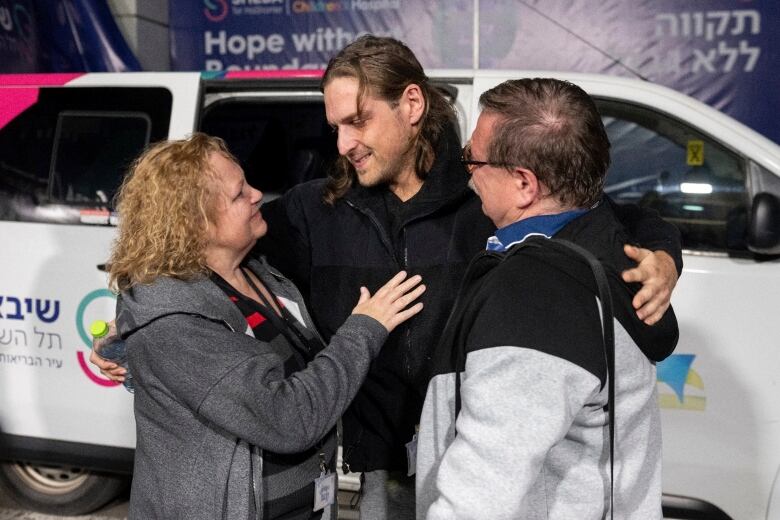 A former Israeli-Russian hostage is reunited with his parents.