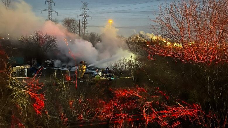 Fire crews quickly knocked down this encampment fire in south London, Wednesday evening.