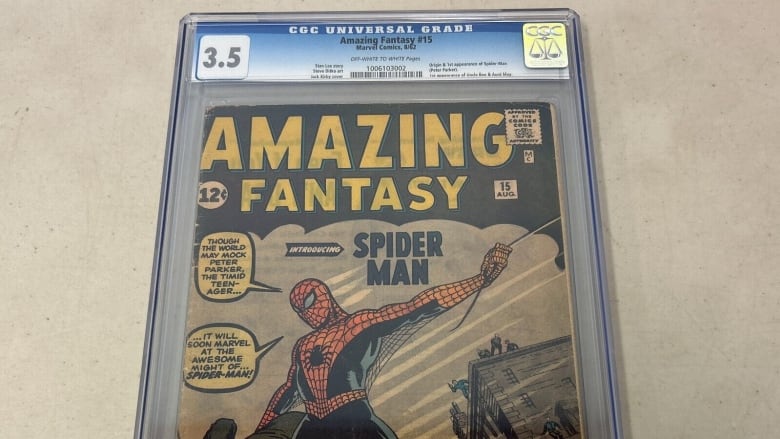 A graded comic book with Spider-Man on the cover.