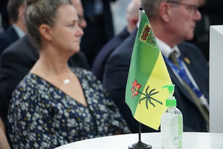 A Saskatchewan flag sits on a white table.