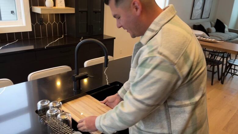 A man plays with a cutting board.