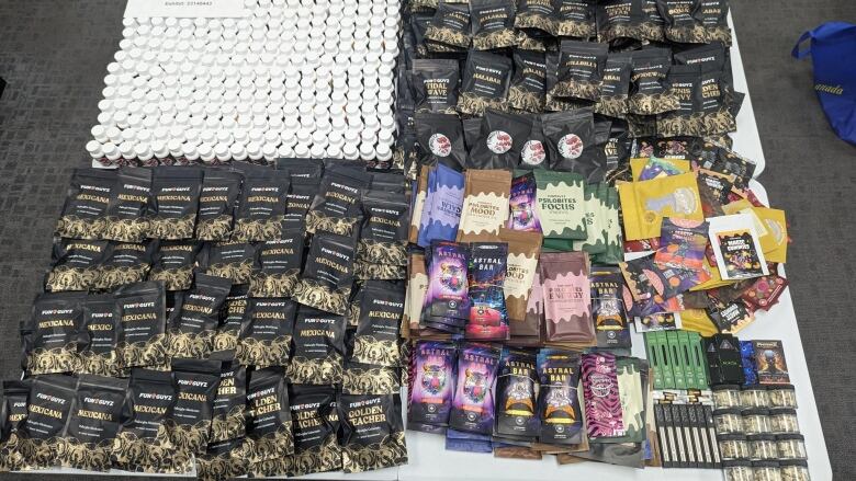 A table full of packages of magic mushroom products.