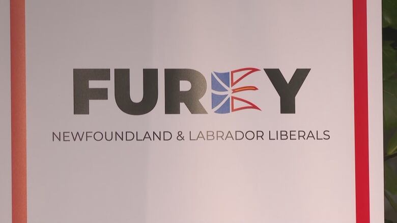 A white banner with red striping on the side reads 'Furey' and 'Newfoundland and Labrador Liberals. The E in 'Furey' is a Newfoundland and Labrador flag.