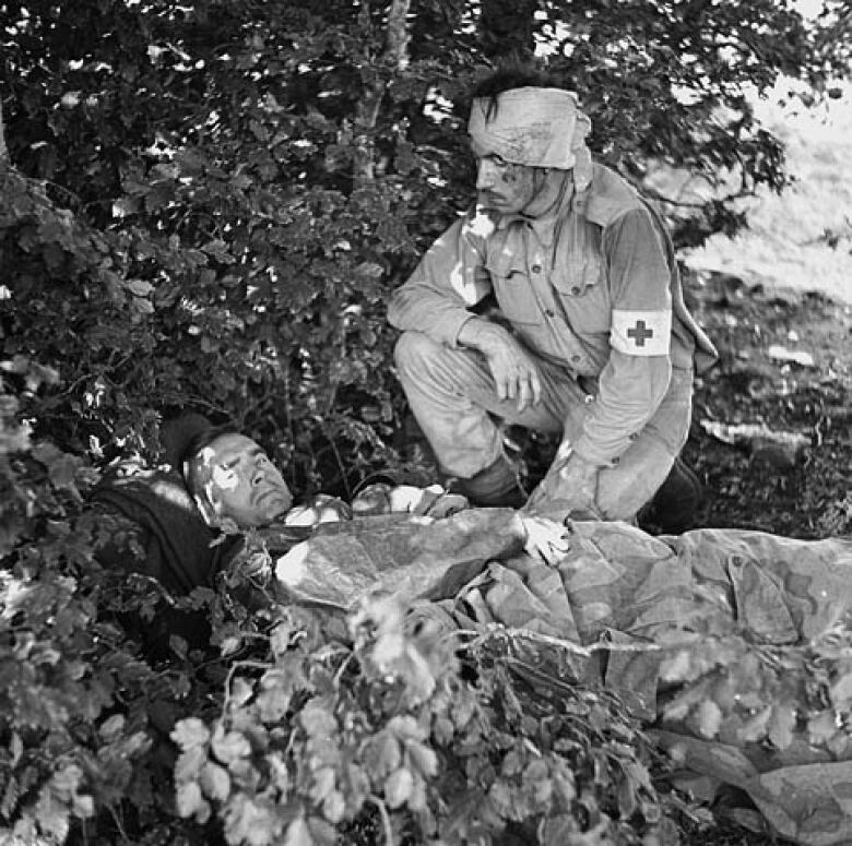 A black and white photo from Italy 1943 shows two injured Canadians who were serving in the Second World War.