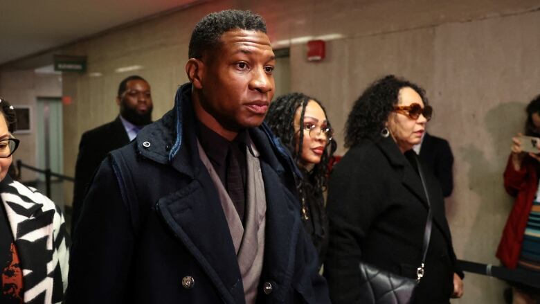 Actor Jonathan Majors arrives with Meagan Good for the jury selection in his  assault and harassment case at Manhattan Criminal Court in New York City, U.S., December 18, 2023. 