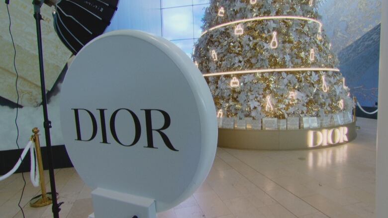 A decorated tree with the Dior logo