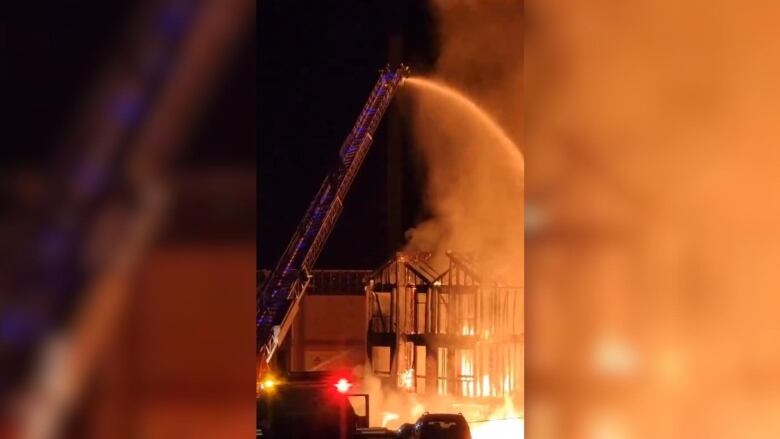 a vertical image of a burning building.