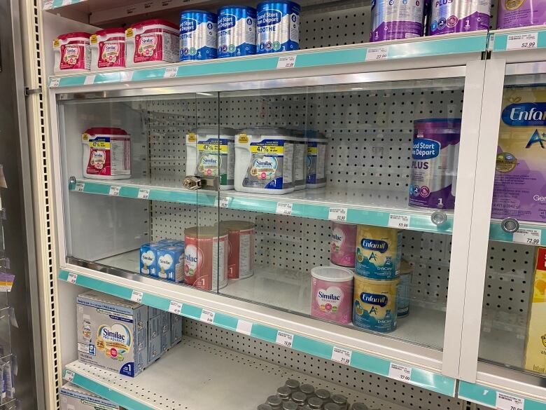 baby formula behind a locked glass shelf.