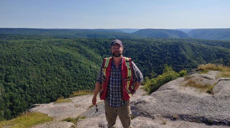 man standing on mountain