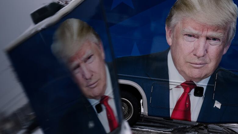 An image of Donald Trump, the former U.S. president, is seen on a bus in Urbandale, Iowa.