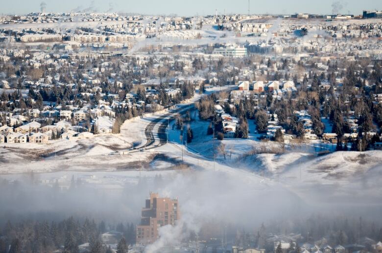 An ice fog hangs over a city.