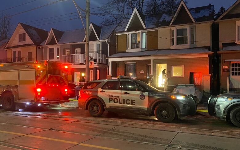 Toronto firefighters and police at the scene of a fatal fire in the east end.